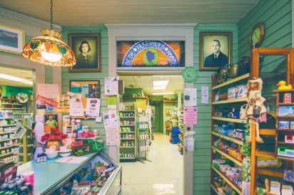 interior of Olde Fashioned Foods includes the original fireplace, antique accesories, and stained glass windows