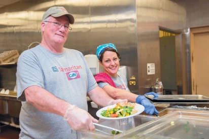 Joe Dukeshire, the Samaritan Cafe chef, and Leslie Tucker serve up plates of nutritious food