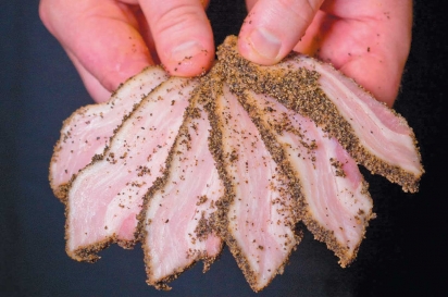 Pork belly from Mason Creek Farm is cured in-house at Tusk & Trotter for bacon.