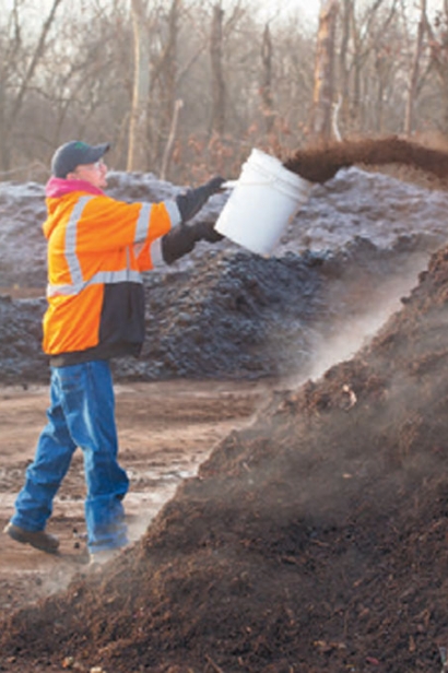 Enzymes are thrown onto the pile to start the Modified Static Aerobic Pile composting process