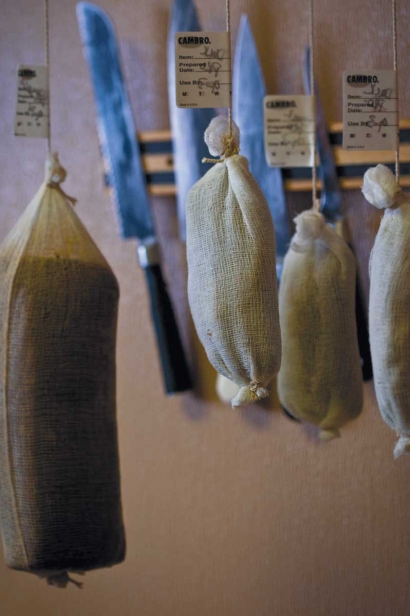 Dry-cured charcuterie is hanging at Tusk & Trotter